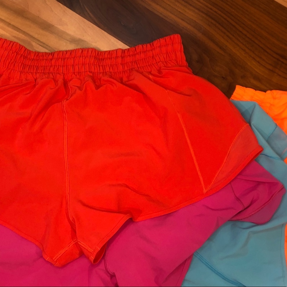 Lululemon hotty hot 2.5” size 8. Blue, red, orange, no tags. Pink is 4”.